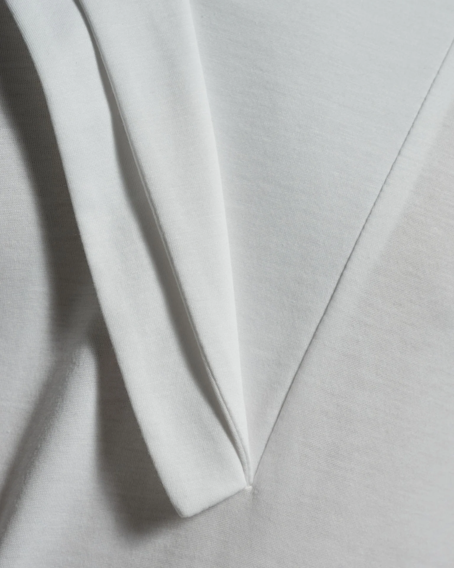 Bib Fronted V-neck with Panelled Shapes